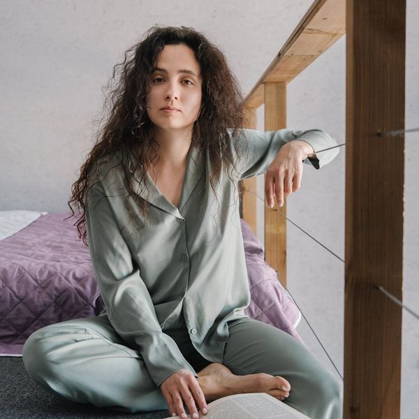 Smiling person feeling calm and refreshed after a light workout session.